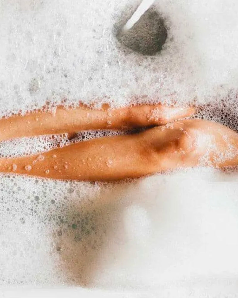 Woman relaxing in bubble bath